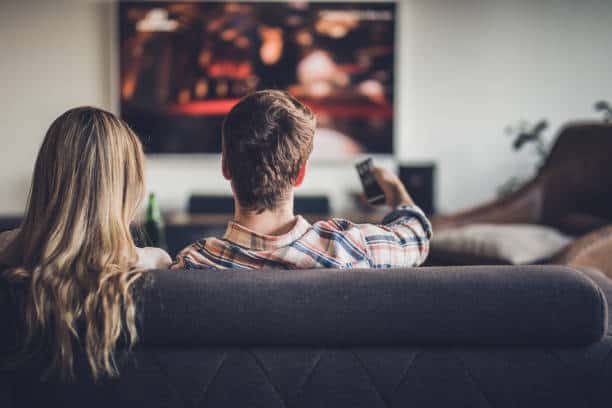 couple watching movies on new tv qled oled